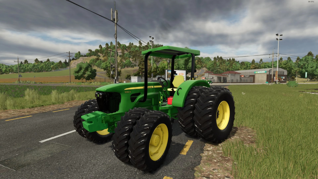 John Deere 50E Series tractor in FS25 mod v1.3.0.0, shown on a rural road with fields and buildings in the background.