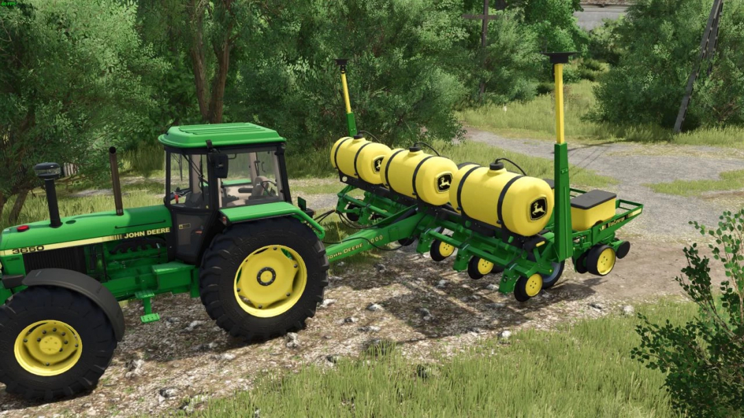 John Deere 7000 v1.0.0.0 mod in FS25, featuring a green tractor with yellow tanks in a grassy landscape.