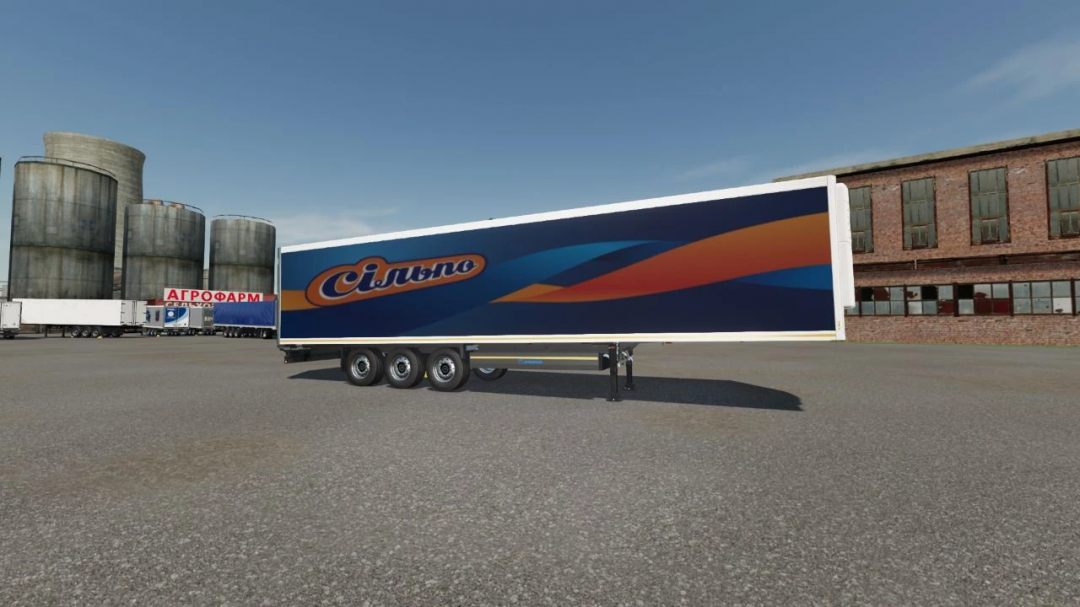 Krone Cooliner trailer mod in FS22 showcasing a blue and orange design in a warehouse lot.