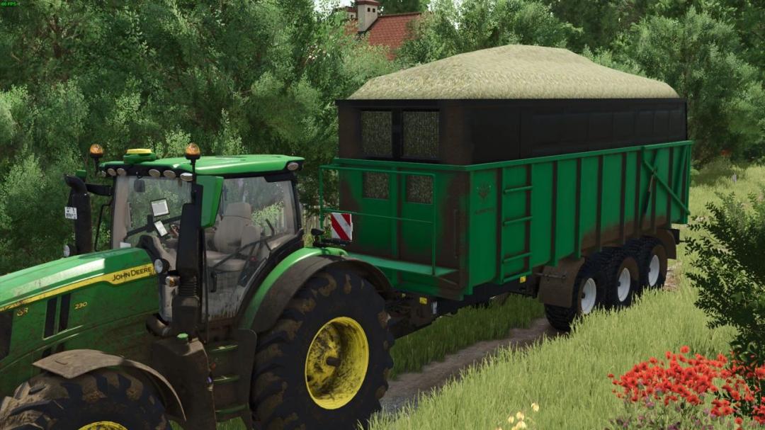 FS25 mod Laumetris 24 Old Generation v1.0.0.0 showing a green tractor with trailer filled with crops in a lush landscape.