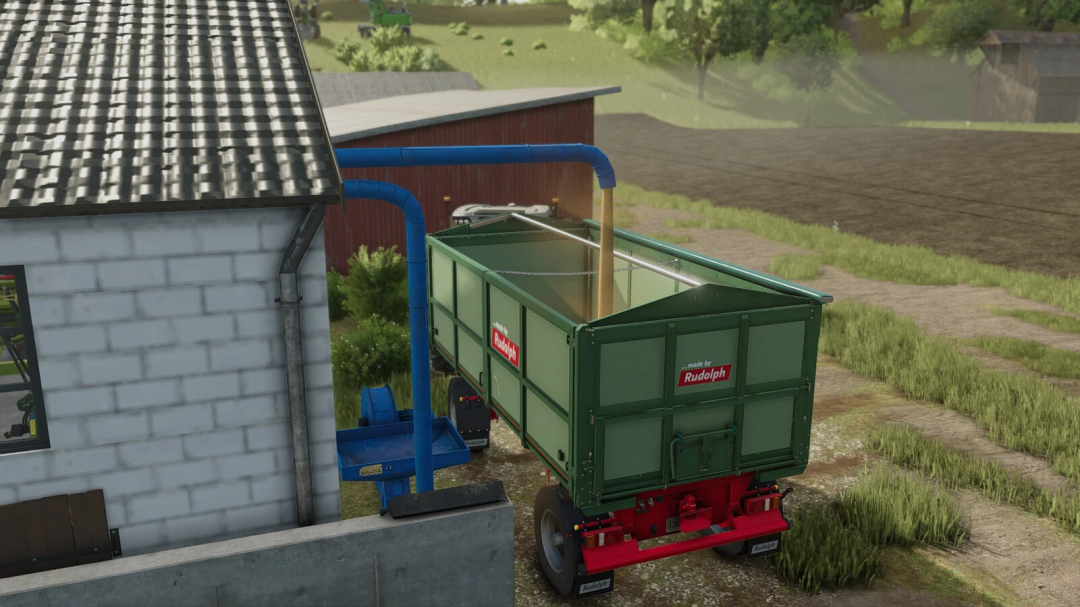 FS25 mod Pneumatic Conveyor For Grain-Silos v1.0.0.0 displaying grain being loaded into a green trailer by a blue conveyor next to a building.