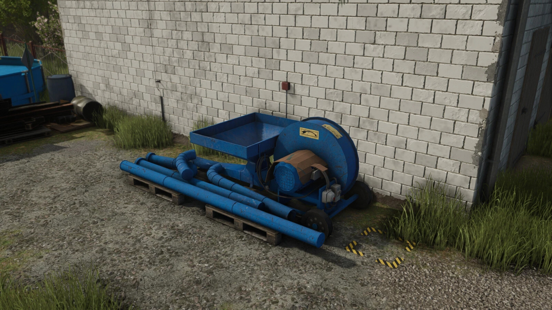 A blue pneumatic conveyor for grain-silos in FS25, shown against a brick wall.