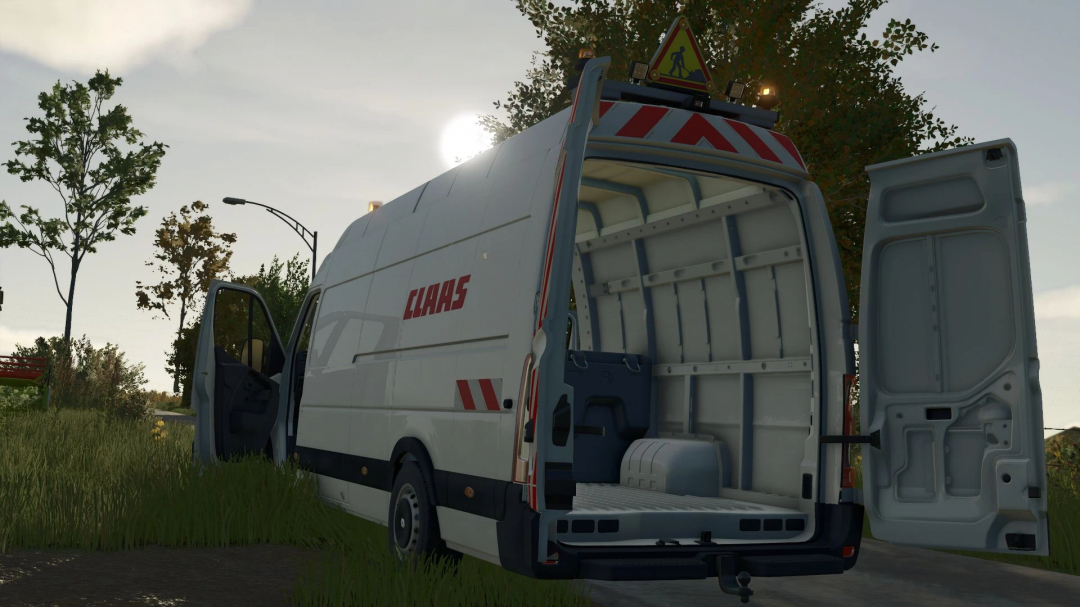 Renault Master L4H3 mod v1.1.0.3 in FS25, showcasing open rear and side doors in a rural environment.