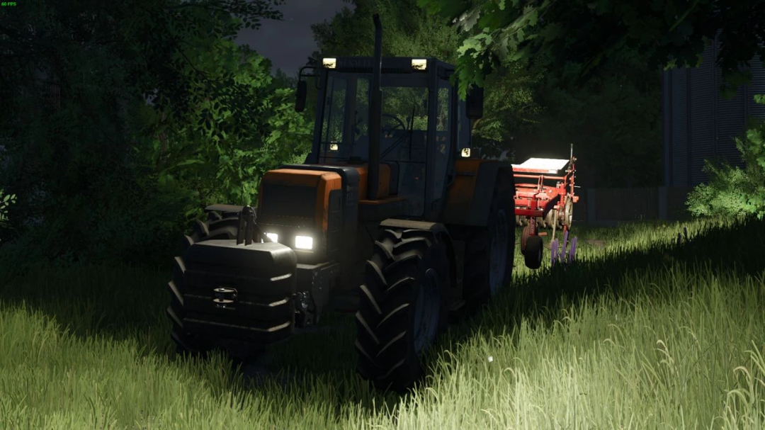 Renault TZ tractor mod in FS25 game, towing equipment at night