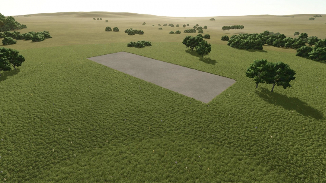 FS25 Terres Perdues mod v1.0.0.0 features a vast green landscape with sparse trees and a rectangular patch of bare ground.