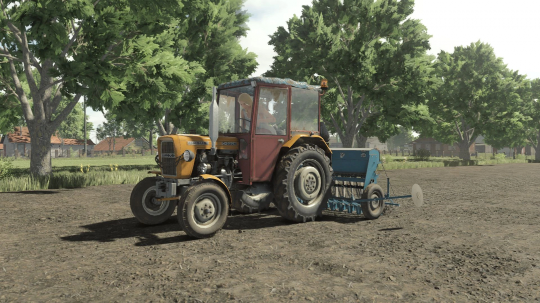 Ursus C-330M tractor mod in FS25, driving on a rural dirt road with trees in the background.