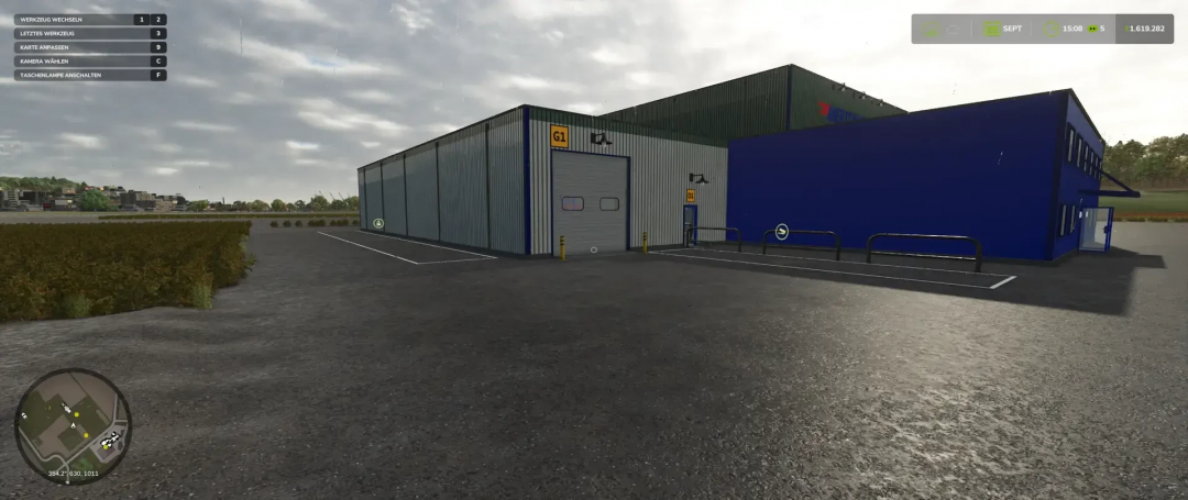 Warehouse with Silo and Gas Station mod in FS25 showing a large industrial building with signage.