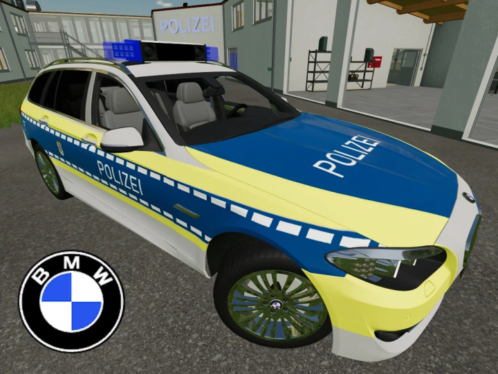 fs22-mods, FS22 mod BMW 5 Touring 2014 v2.0.0.0 in police livery parked outside a station