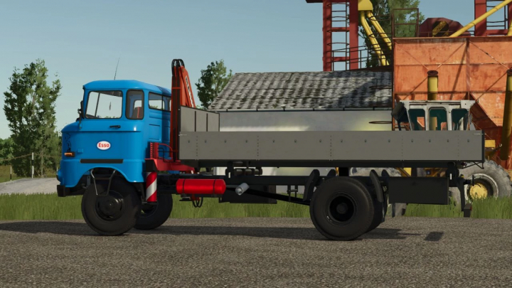 fs25-mods, IFA W50 + KCR mod in Farming Simulator 25, featuring a blue truck with a crane. FS25 mods add realism to virtual farming.