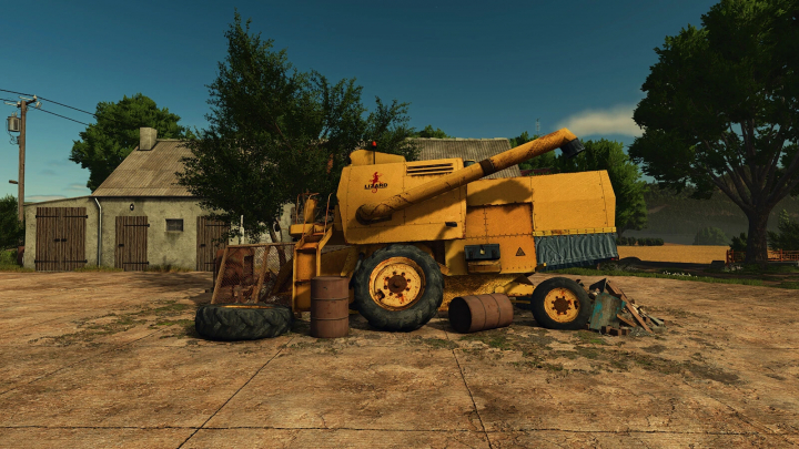 fs25-mods, FS25 mod Scrap For The Farm v1.0.0.0 showing an old yellow harvester and scrap in farmyard.