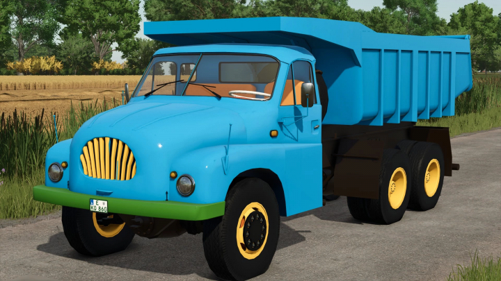 fs25-mods, Blue Tatra T 138 truck mod in FS25 by a field, showcasing its design.