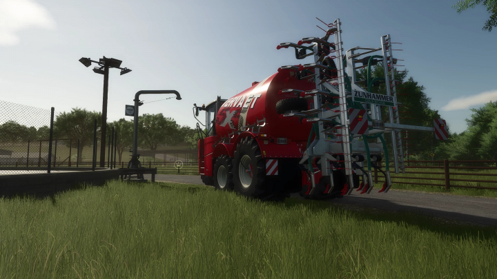 fs25-mods,  FS25 mod Vibro Plus v1.0.0.0 tractor with Zunhammer attachment on a grass road.