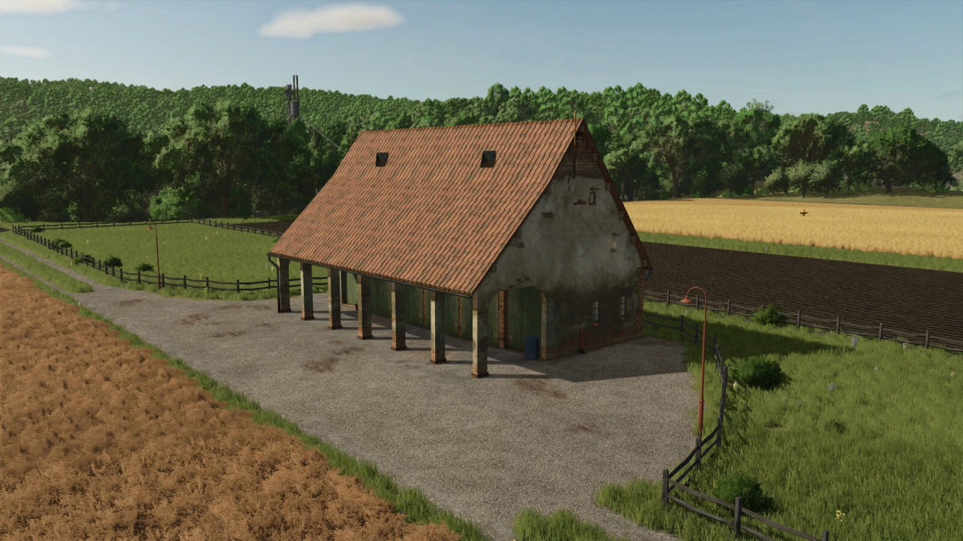 FS25 Attic mod v1.0.0.0 featuring a rustic barn set amidst lush fields and trees.