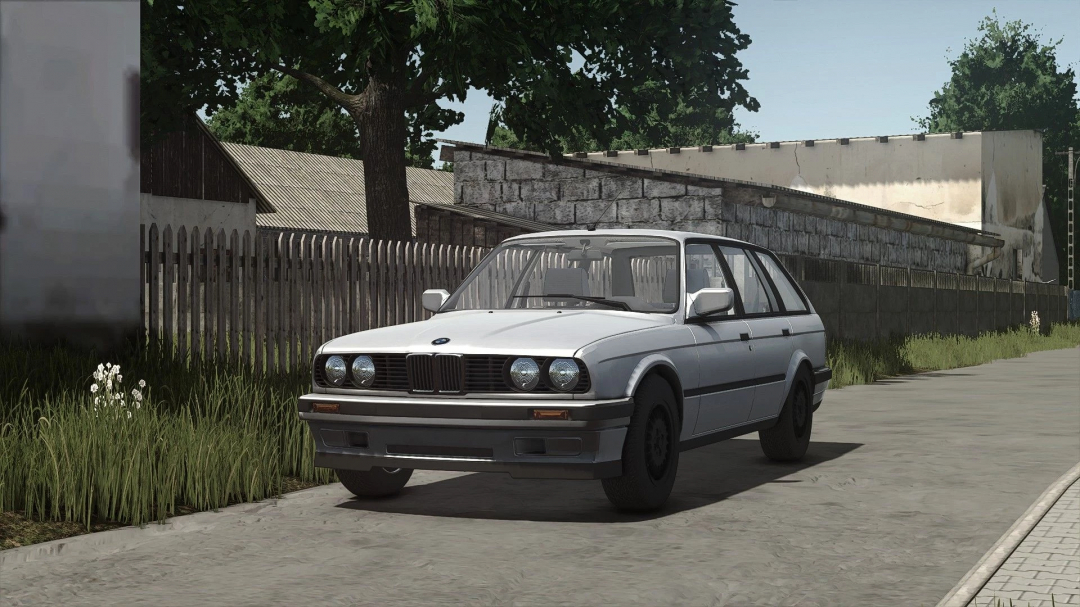 BMW E30 Touring mod for FS25 in a rural setting, highlighting vehicle detail and environment.