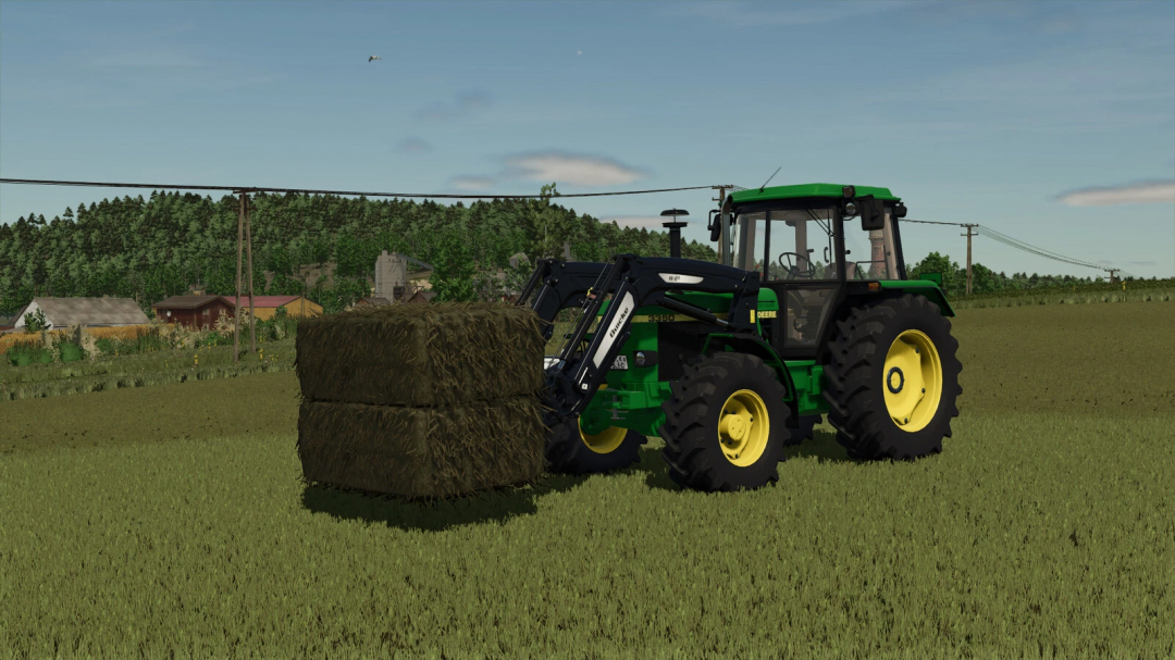 FS25 mod image showing a tractor lifting square bales in a farm field.