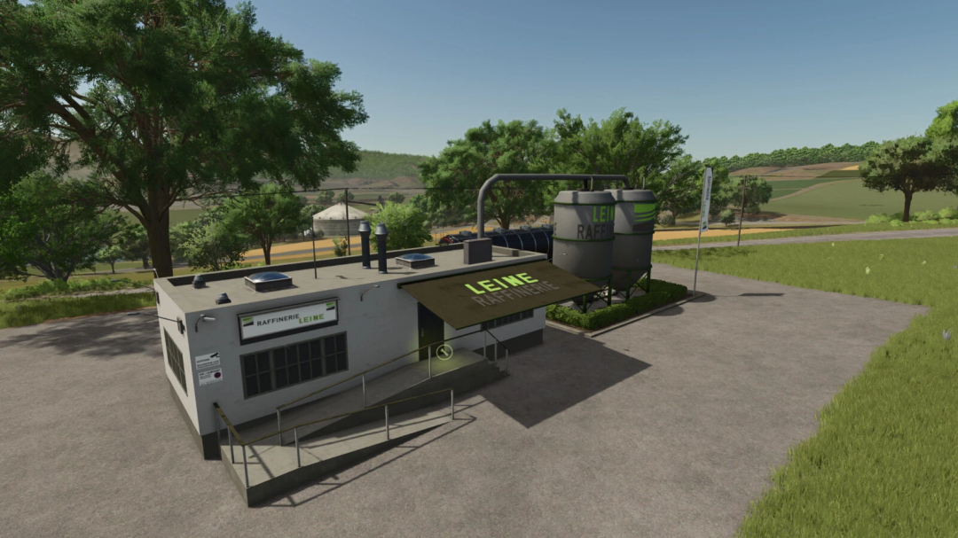 FS25 mod Diesel Production v1.0.0.0 showing a refinery building with tanks in a rural landscape.