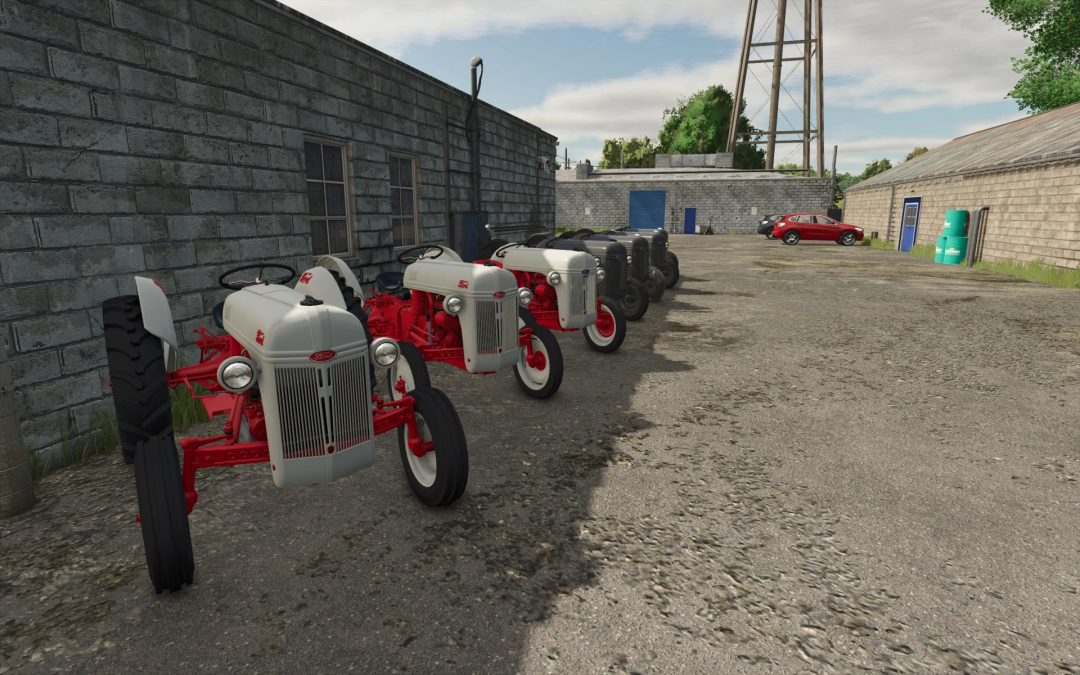 Ford N series tractors in Farming Simulator 25 mod, parked beside a stone building.