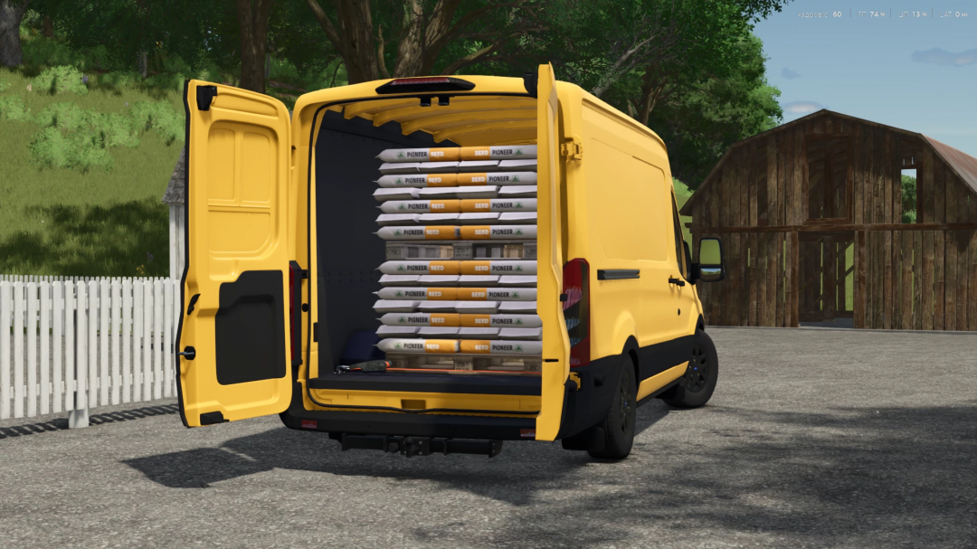 Yellow Ford Transit MK8 mod in FS25 with open doors showing seed bags inside.