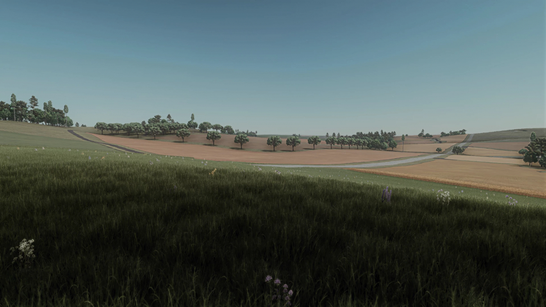 Scenic landscape of Forest Wisconsin mod in Farming Simulator 25, featuring wide fields and trees under a clear sky.