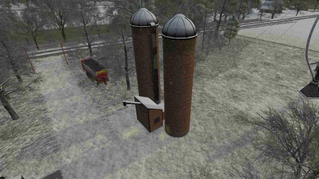 Grass Fermentation Silage Silo mod in FS25, featuring two tall brick silos surrounded by snow and trees.