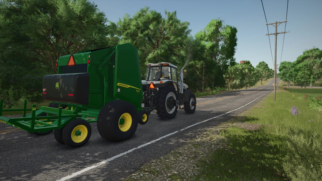 John Deere 561R and A520R Accumulator mod in FS25, showing a tractor towing equipment on a rural road.