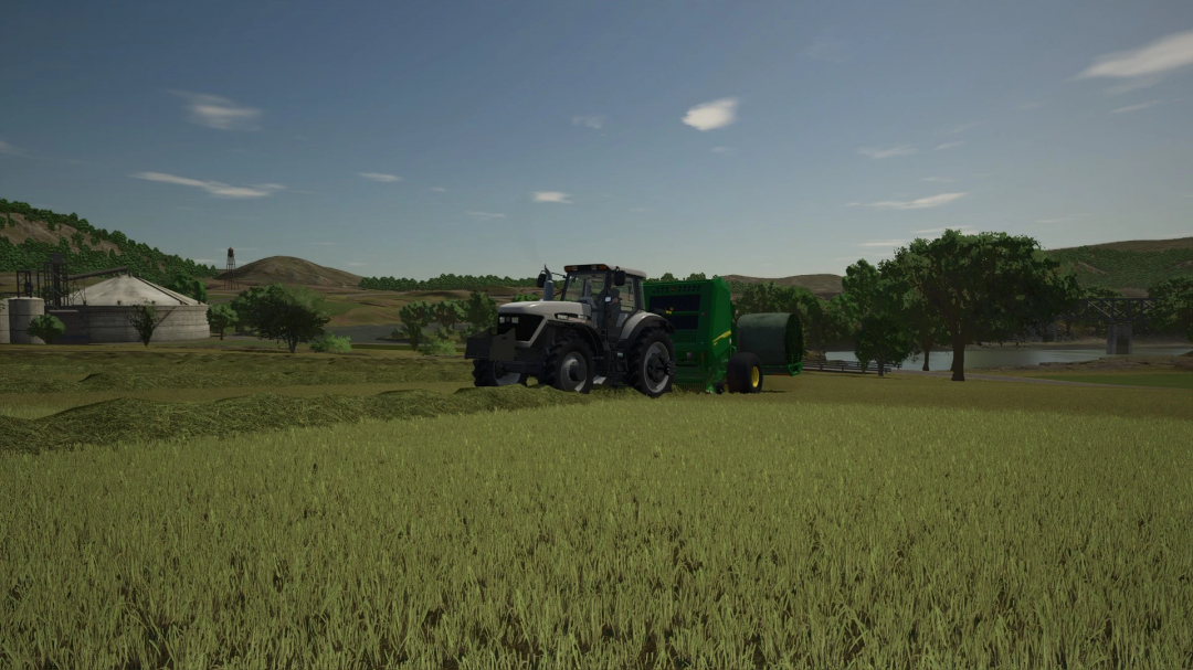 FS25 mod John Deere 561R+A520R Accumulator on a farm landscape, showcasing realistic farming equipment.