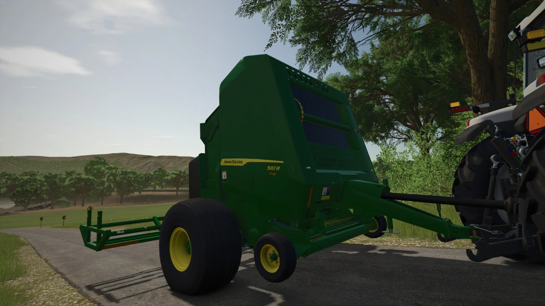 John Deere 561R+A520R Accumulator mod in FS25, showcasing detailed farm equipment in a rural setting.