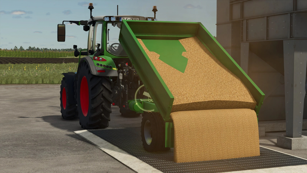 Lizard 4T mod in FS25 dumping grain beside the tractor.