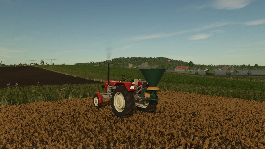 FS25 mod Lizard N-012 v1.0.0.0 showing a red tractor in a field with a green fertilizer spreader.