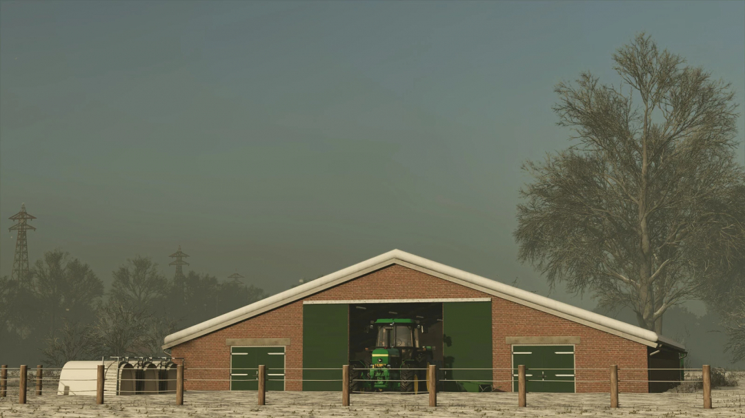 Old cowshed mod for FS25 showing a barn with a tractor inside, surrounded by trees and mist.