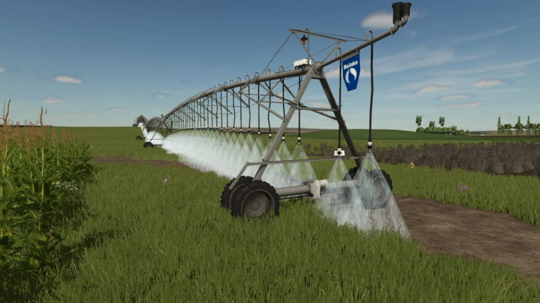 Reinke Linear Irrigation System mod in FS25 watering a field with green crops.