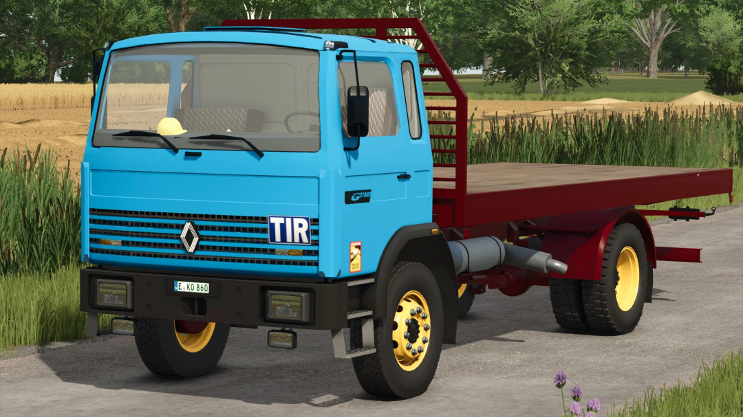 Renault G210 truck mod in FS25 with blue cab and red flatbed on rural road.