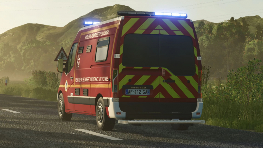 Farming Simulator 25 mod - Renault Master III VSAV emergency vehicle on a rural road.