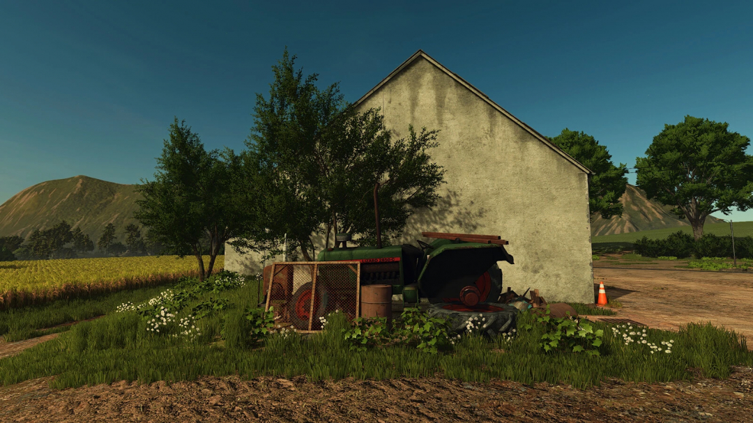 FS25 mods scene featuring a rustic farm setting with old machinery and vegetation, Scrap For The Farm v1.0.0.0.