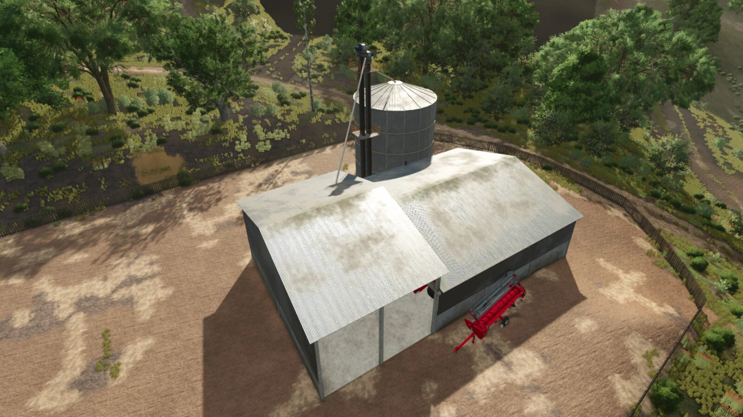 Aerial view of Silo Deep Ranch mod in Farming Simulator 25 with a large silo and a barn surrounded by trees.