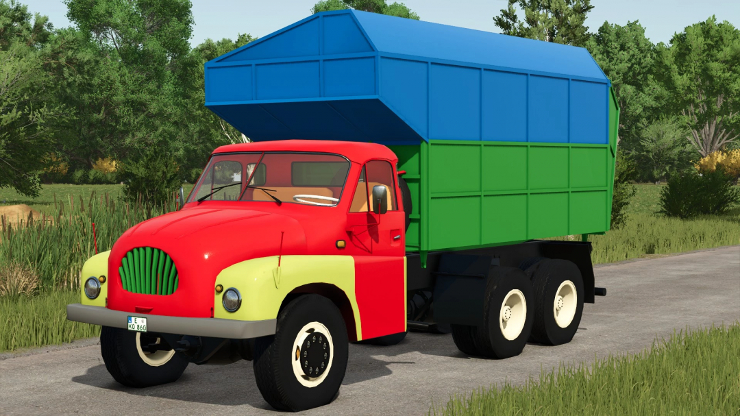 FS25 mod Tatra T 138 truck with colorful trailers on a country road.