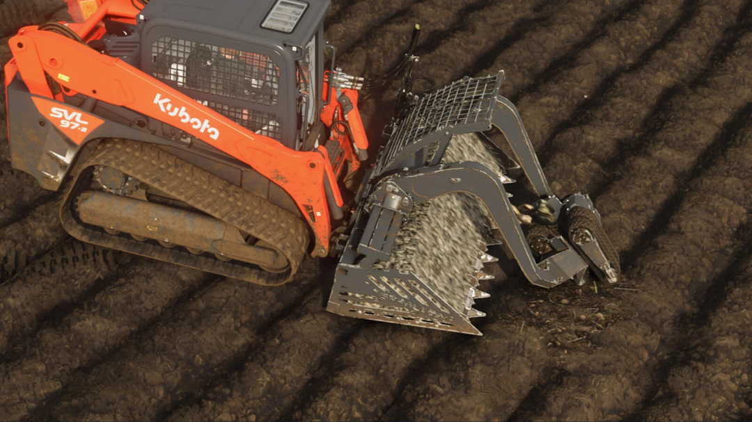 FS25 mod: TerraClear TC100 in action, clearing rocks from a field.