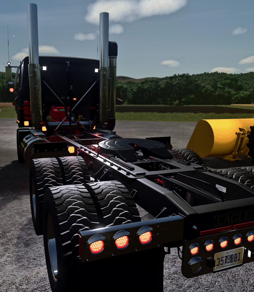 Transtar Edit v1.0.0.0 mod for FS25, showcasing a detailed rear view of a powerful truck with polished exhaust stacks and heavy-duty tires.