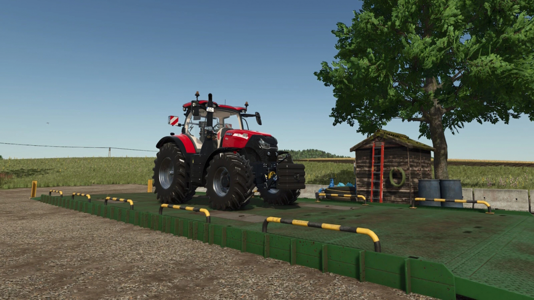 FS25 mods Washingarea v1.0.0.0 showing a tractor on a wash platform beside a small shed and tree.