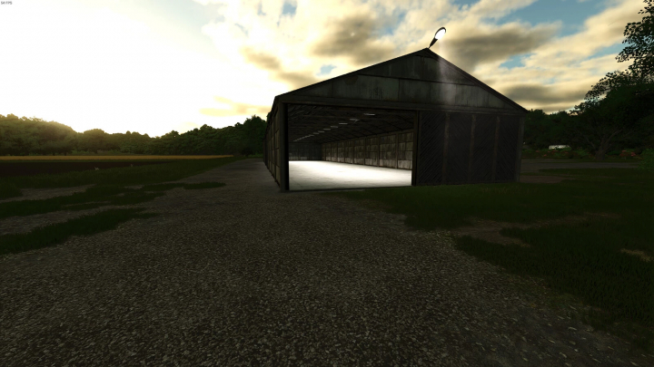 fs25-mods,  Grain Warehouse mod for Farming Simulator 25, featuring a large metal structure under a cloudy sky.