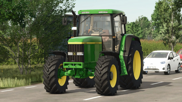 fs25-mods, John Deere 6010 Series tractor mod in FS25, showcasing its detailed design on a road with trees and cars in the background.