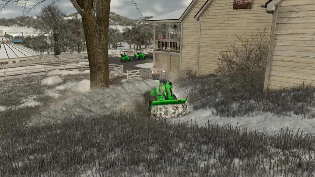 Snow removal with AVANT-Series mod in FS25 near a wooden farmhouse.