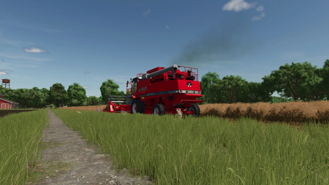 Red combine harvesting wheat field in FS25 with Exhaust Extension mod, enhancing gameplay realism.