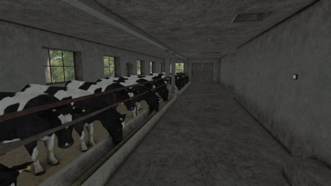 Interior of FS25 Small Old German Cowbarn mod showing cows lined up in stalls.