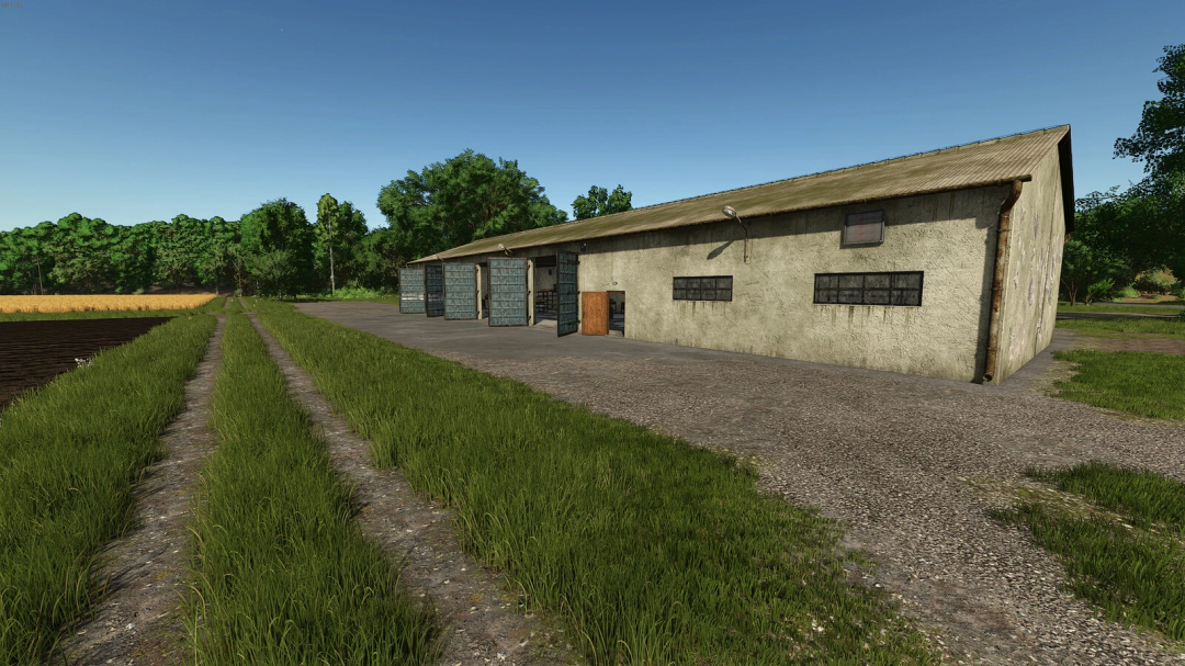 Garage with workshop mod in Farming Simulator 25, featuring an open-sided building next to a grassy path and field.