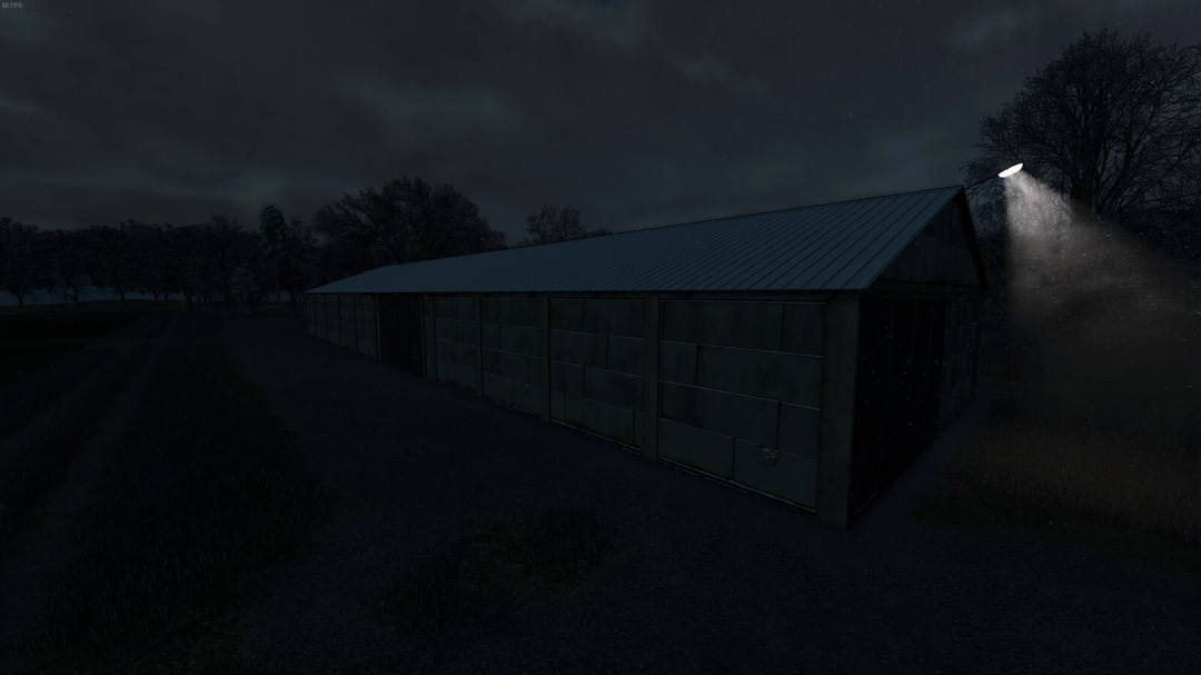 Nighttime view of a grain warehouse in Farming Simulator 25 mod, with exterior lights illuminating the building.