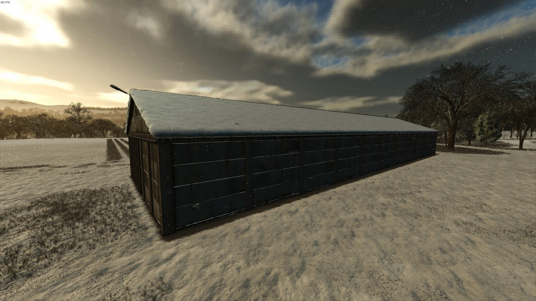 FS25 mod Grain Warehouse v1.0.0.0 in a snowy field at sunset.