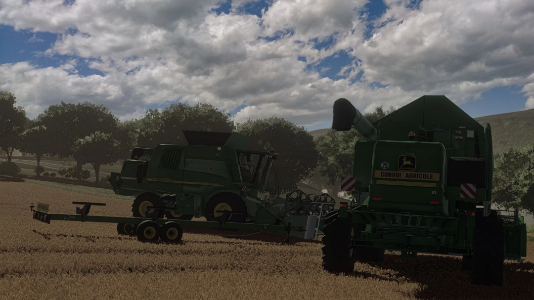 John Deere WTS/I Series combine harvester mod for FS25 in a field, with trees and cloudy sky in the background.