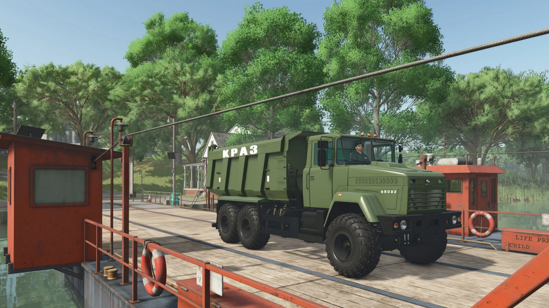 Kraz 65032 truck mod in FS25 driving on a wooden platform with trees in the background.