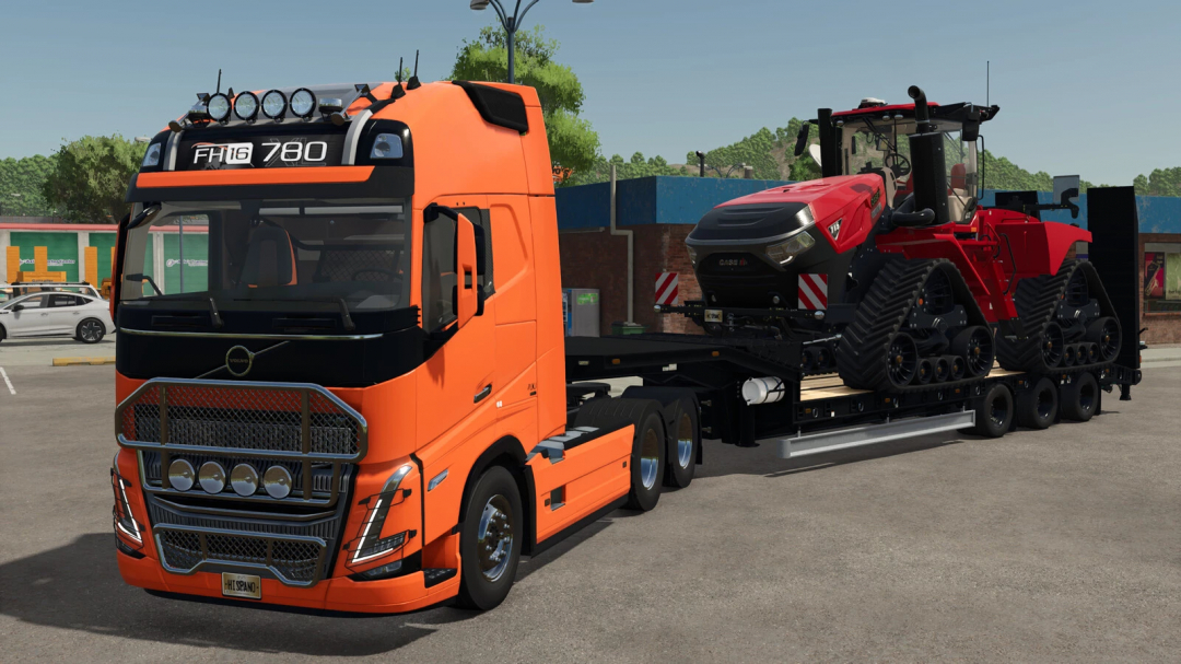 FS25 mod Low Loader Galtrailer v1.0.0.0 transporting a large tractor on an orange truck in Farming Simulator 25.